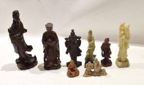 Group of eight Chinese figures of immortals or deities including four wooden carved figures, one