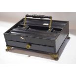 19th century ebonised ink stand with brass mounted swing handle and brass paw feet, 30.5cm wide