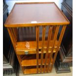 Mahogany revolving bookcase fitted with sections and drawers, 183cm high