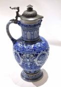 German stoneware Westerwald ewer with mask lip, inscription around centre with moulded designs,