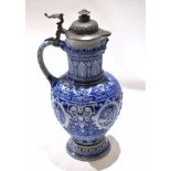 German stoneware Westerwald ewer with mask lip, inscription around centre with moulded designs,