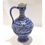Very large German stoneware pottery ewer with rope twist handle and applied designs in blue, 43cm