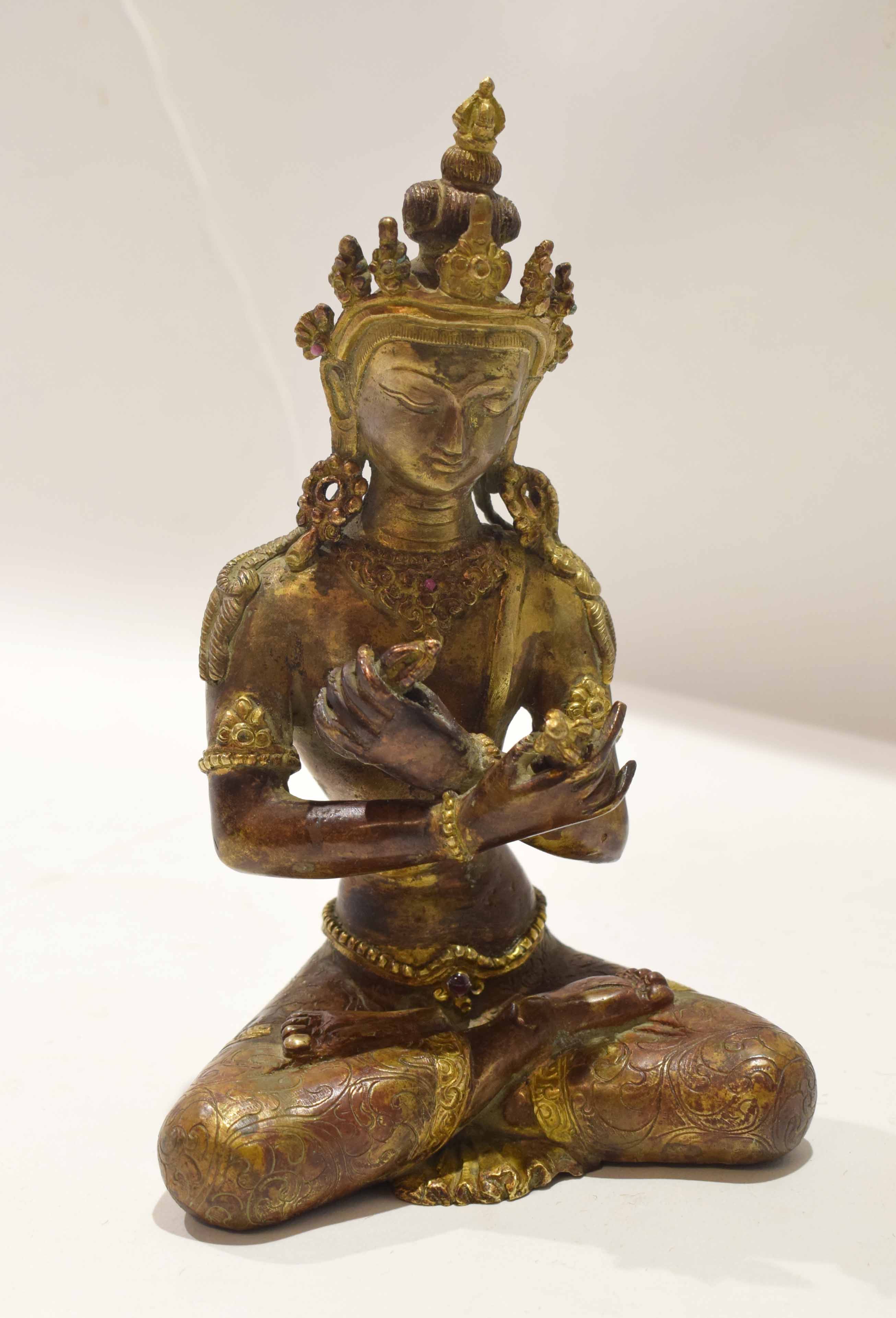 Oriental bronzed effect of Buddha Shakayamuni in classic pose, 20cm high