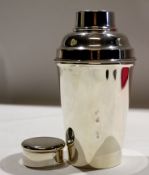 Silver plated cocktail shaker of usual form, 21cm high