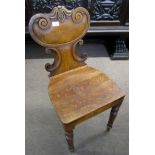 19th century oak hall table chair, with C-scroll moulded back and solid seat