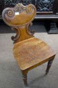 19th century oak hall table chair, with C-scroll moulded back and solid seat