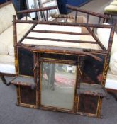 Late 19th century bamboo overmantel with central mirror, shelf over with shelf to each side dividing