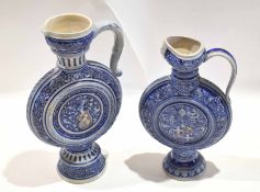 Two salt glaze German pottery ewers, ovoid bodies with armorial designs (2)