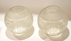 Pair of early 20th century globular glass oil lamp shades etched with stylised foliage, 18cm diam