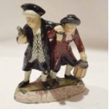 Late 19th century Staffordshire group of revellers on an oval base, 23cm high