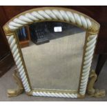 Painted and parcel gilded overmantel mirror with arched top, applied below with dolphin supports,