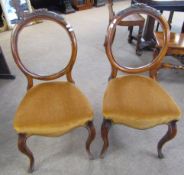 Set of four Victorian walnut balloon back dining chairs, rust upholstered seats and cabriole front