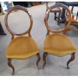 Set of four Victorian walnut balloon back dining chairs, rust upholstered seats and cabriole front