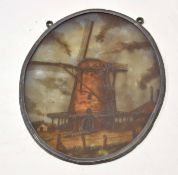 Oval painted on glass plaque depicting a windmill in an alloy frame, 25cm high