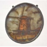 Oval painted on glass plaque depicting a windmill in an alloy frame, 25cm high