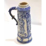 Very large German stoneware stein or tankard decorated with kings in relief tinged with blue with