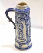 Very large German stoneware stein or tankard decorated with kings in relief tinged with blue with