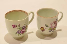 Two 18th century Worcester porcelain cups both with floral designs, one with brown line rim (2)