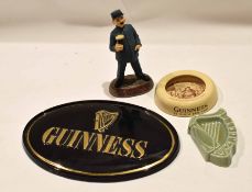 Group of Guinness collectables including an Ashtead ash tray with a Sam Weller type design, a