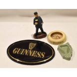 Group of Guinness collectables including an Ashtead ash tray with a Sam Weller type design, a