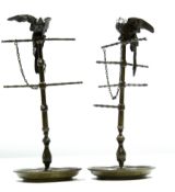 Pair of bronze or cast metal ring stands, each crested with perched birds, 22cm high