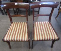 Set of four late Regency mahogany curved bar back dining chairs on sabre legs, with drop in