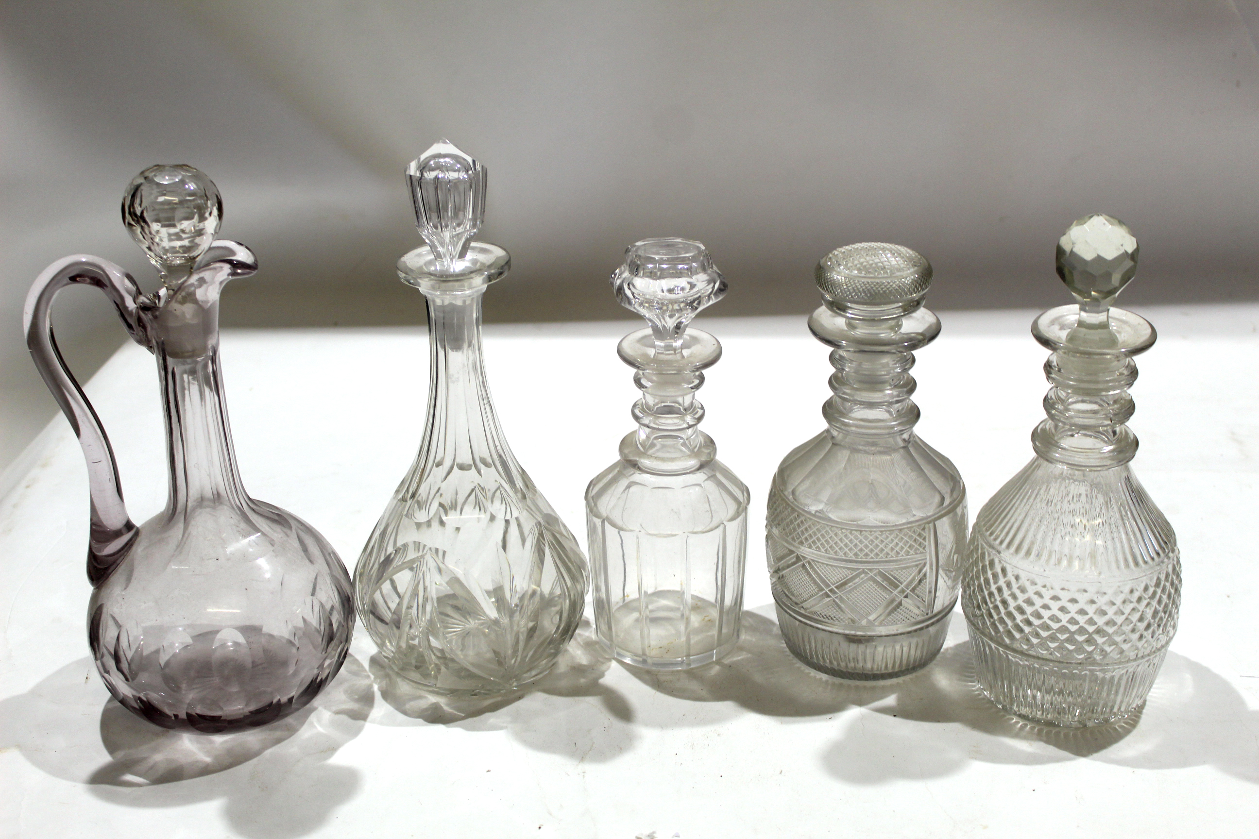 Group of 19th century cut glass decanters and stoppers, (5)