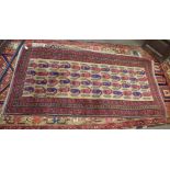 Caucasian carpet, central panel of geometric designs, beige and puce field, .92 x 1.7m