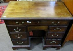 Early 19th century mahogany Queen Anne style kneehole desk, full width frieze drawer over central