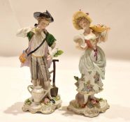 Pair of late 19th century Continental porcelain figurines of a gardener and flower seller