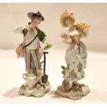 Pair of late 19th century Continental porcelain figurines of a gardener and flower seller