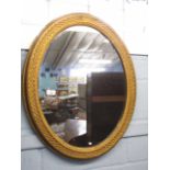 Gilt framed oval wall mirror with beaded and latticed surround, 70cm wide