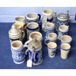 Collection of German Westerwald type stoneware tankards, most with German mottos and typical