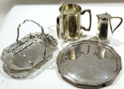 Various silver plated wares including salver, three-handled large tyg, hot water jug, cake dish