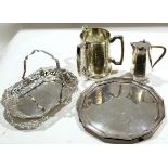 Various silver plated wares including salver, three-handled large tyg, hot water jug, cake dish