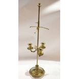 Three branch brass candelabrum with adjustable central shade holder, 77cm high
