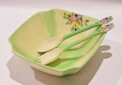 Shorter salad bowl of Art Deco shape, decorated with flowers, together with two servers, the bowl