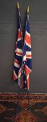 Two Union Jack flags, gilded pointers and dark blue stems, 157cm long
