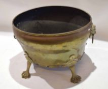 Brass two-handled oval planter applied with lion mask ring handles and raised on paw feet, 18cm