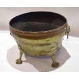 Brass two-handled oval planter applied with lion mask ring handles and raised on paw feet, 18cm