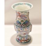 Chinese porcelain Gu shaped vase decorated in famille vert enamels in Wucai style with a dragon
