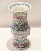 Chinese porcelain Gu shaped vase decorated in famille vert enamels in Wucai style with a dragon