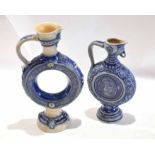 Two German pottery ewers with armorial designs in underglaze blue (2)