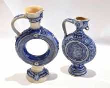 Two German pottery ewers with armorial designs in underglaze blue (2)