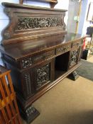 Italian dark oak sideboard pediment moulded with foliage and scrolls over three drawers and