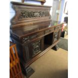 Italian dark oak sideboard pediment moulded with foliage and scrolls over three drawers and