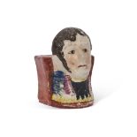 Unusual early 19th century Staffordshire plinth, the front modelled possibly as Napoleon, 10cm high