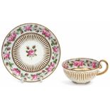 Early 19th century cabinet cup and saucer, the exterior with a gilt design, the interior with a