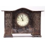 Decorative late 19th/early 20th century silver plated cased mantel clock with plain serpentine