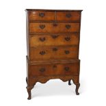 Late 18th century walnut chest on stand with cross banded drawers with two short over four full